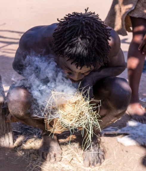 A Damara demonstrates traditional techniques of making fire.